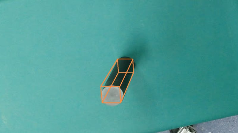 A bottle lying on a desk with its ground-truth 3D box