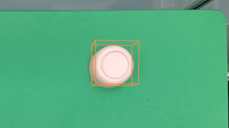 An upside-down bowl on a desk with its ground-truth 3D box